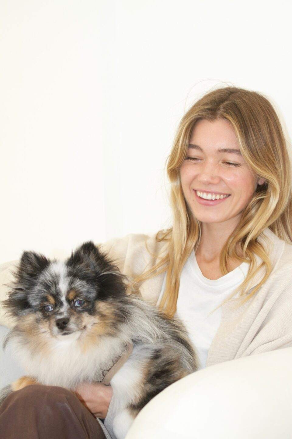 Smiling Woman with her Dog after receiving Sealants at S&C Dental Beverly Hills clinic in CA.