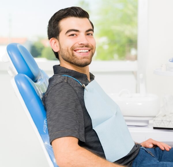 Dental Patient Sitting in a Chair - S&C Dental Beverly Hills