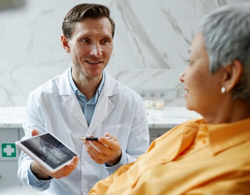 Dentist explaining a CT scan report to the patient