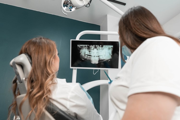 A couple of women looking at an x-ray