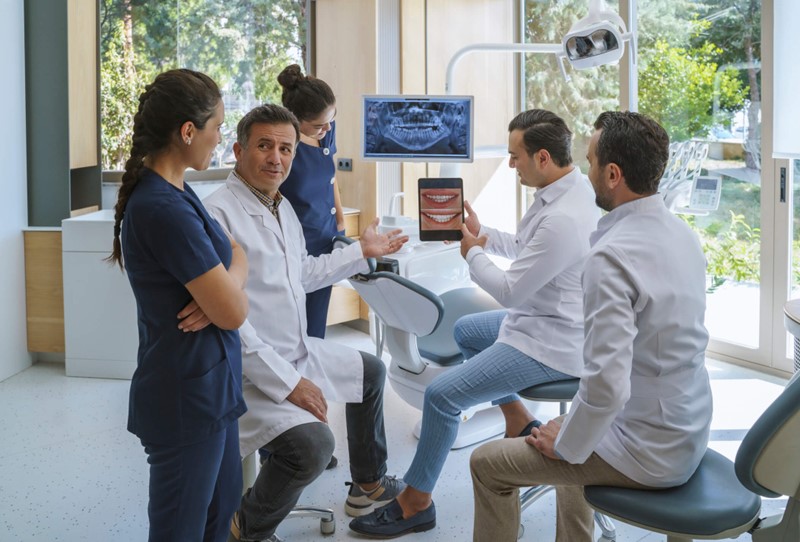 A group of people in a dental office