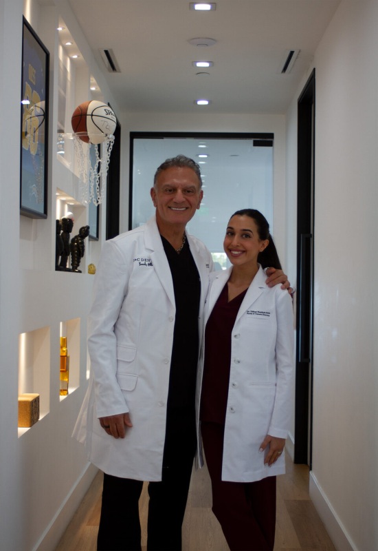 Dr. Kouroush Maddahi and Dr. Tiffany Maddahi are posing together in Beverly Hills, CA
