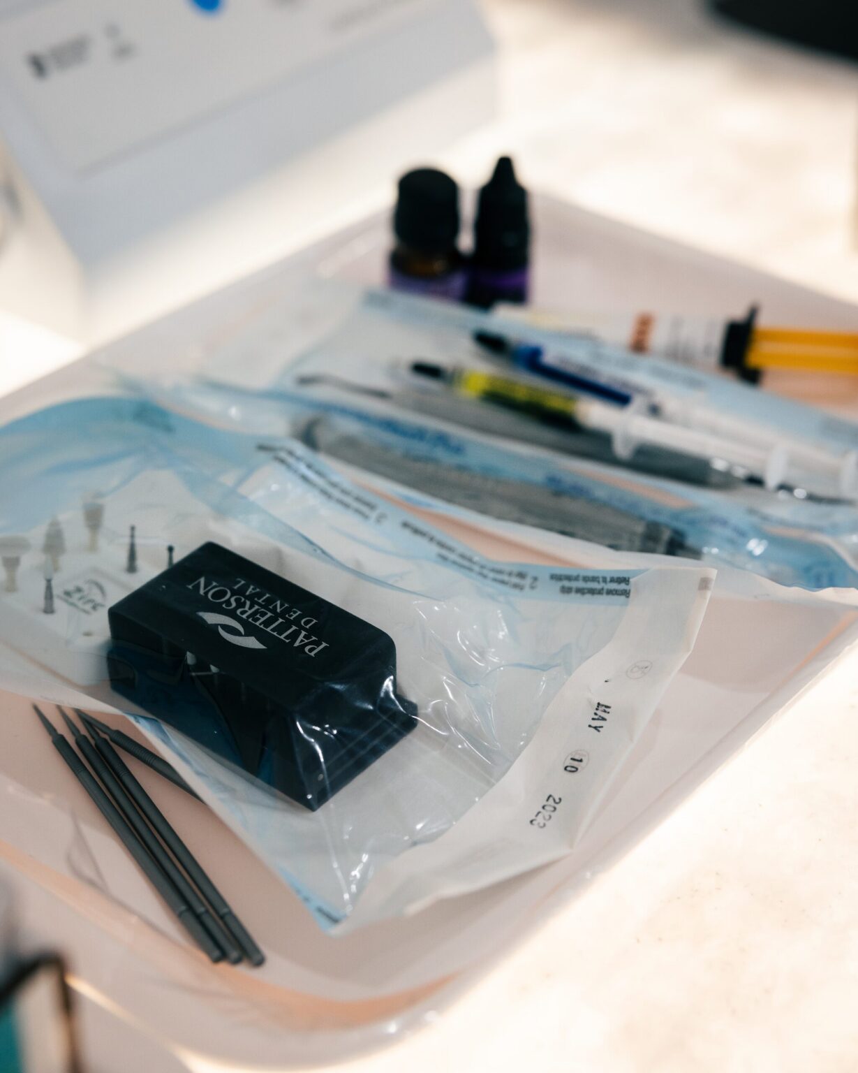 A sealed sterile pouch of instruments prepared for a patient