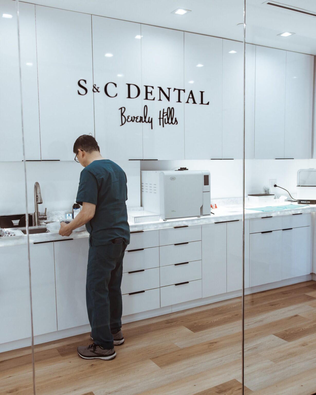 A team member preparing a treatment room at S&C Dental Beverly Hills